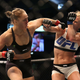 Ronda Rousey whiffing a punch against Holly Holm. Image credit: Quinn Rooney/Getty.